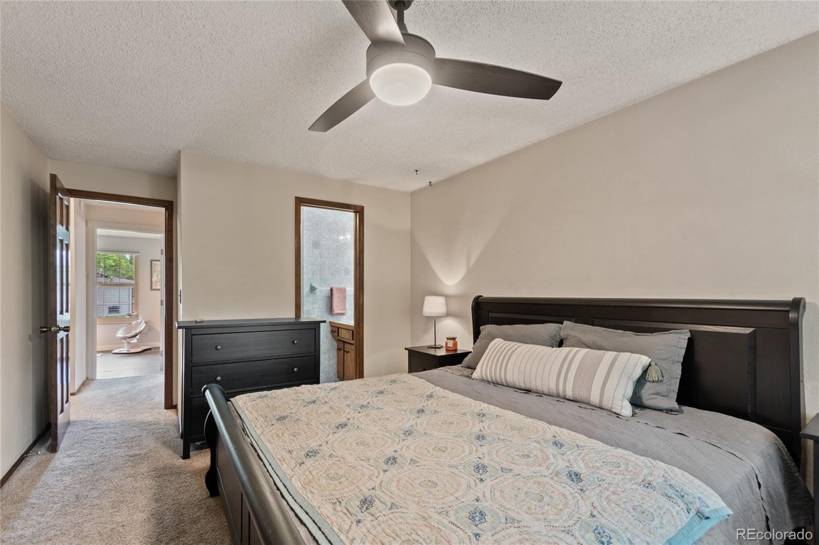 3315 Marshall Street Wheat Ridge, CO 80033 - Photo 15 of 30 a bedroom with a bed and a dresser