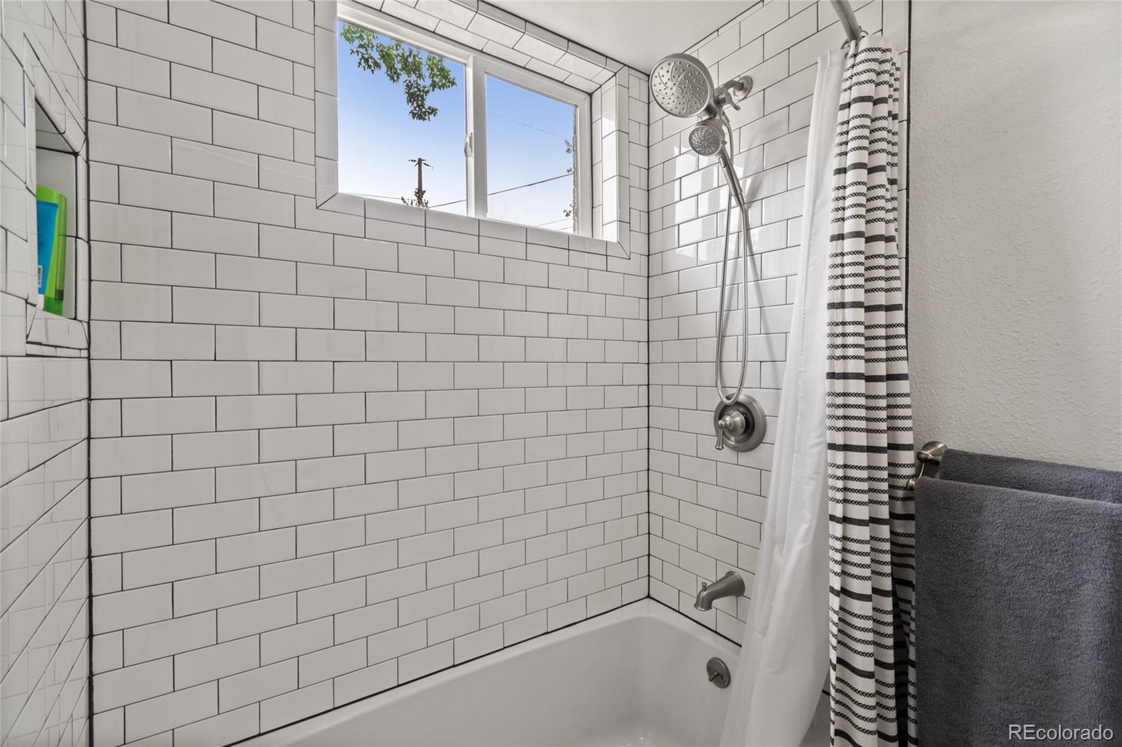 3315 Marshall Street Wheat Ridge, CO 80033 - Photo 21 of 30 a bathroom with a bathtub and shower