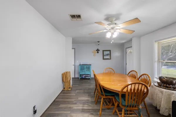 a dining room with furniture and window