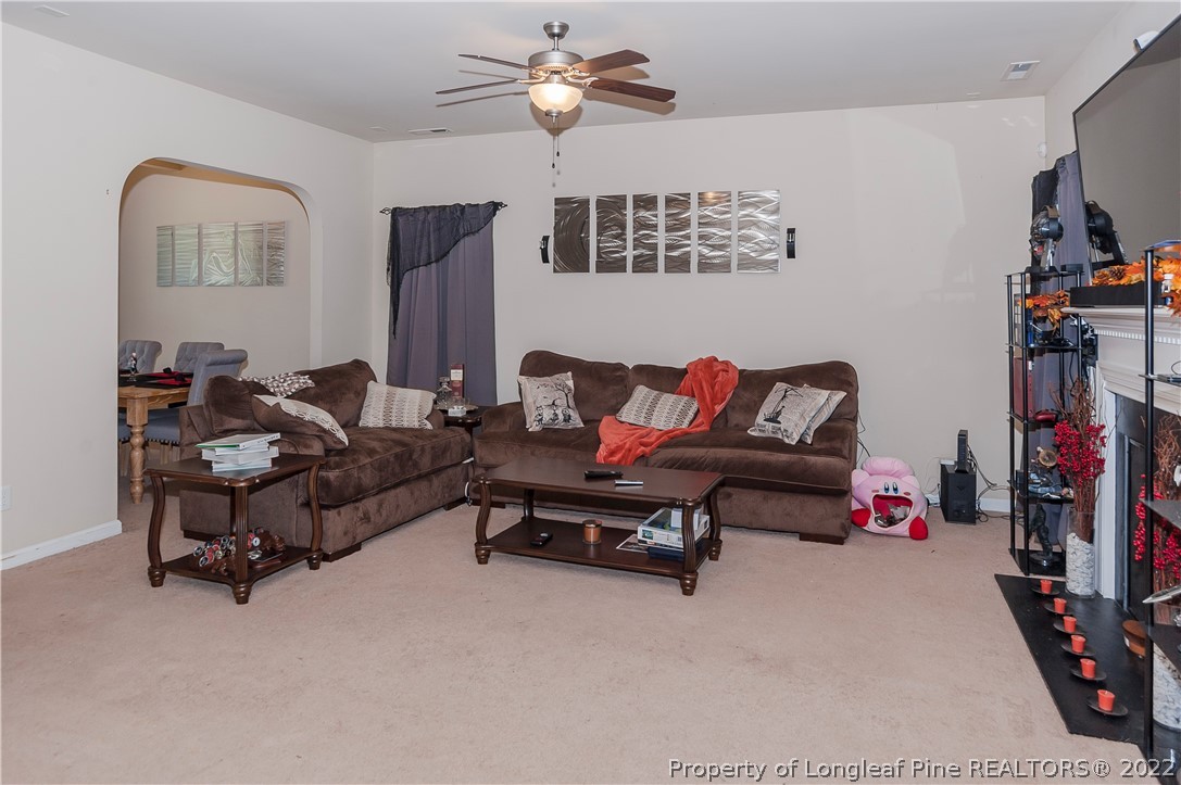 4980 Aberdeen Road Raeford, NC 28376 - Photo 11 of 38 a living room with furniture and a flat screen tv