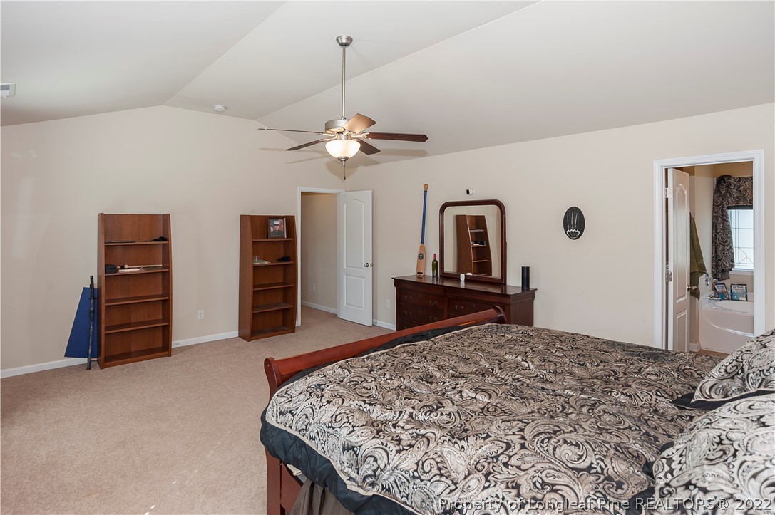4980 Aberdeen Road Raeford, NC 28376 - Photo 20 of 38 a living room with furniture and a flat screen tv
