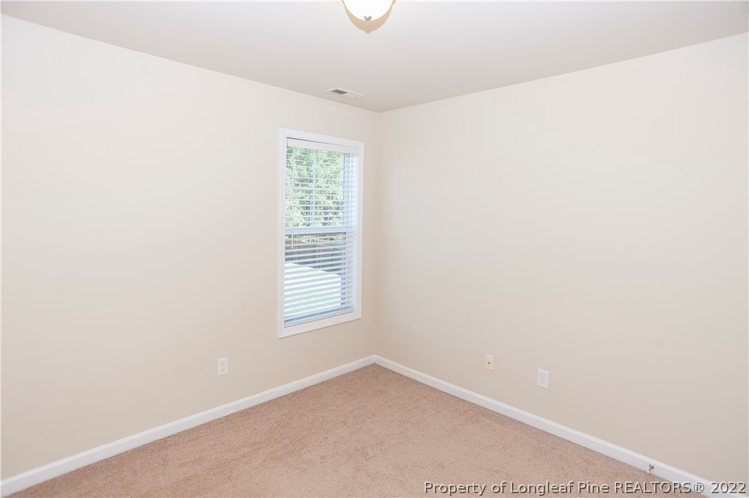 4980 Aberdeen Road Raeford, NC 28376 - Photo 28 of 38 an empty room with windows