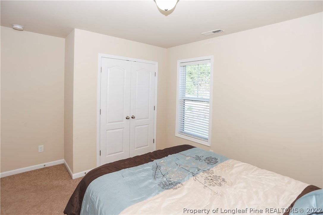 4980 Aberdeen Road Raeford, NC 28376 - Photo 30 of 38 a bedroom with a bed and a window