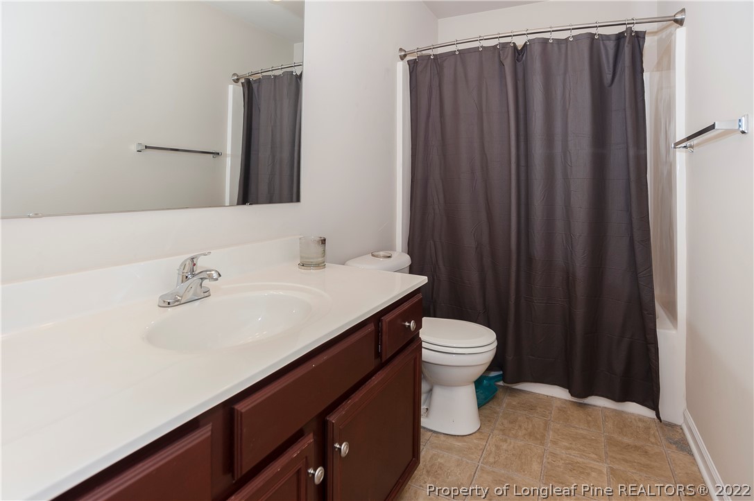 4980 Aberdeen Road Raeford, NC 28376 - Photo 33 of 38 a bathroom with a sink and a toilet