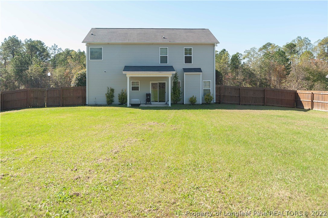 4980 Aberdeen Road Raeford, NC 28376 - Photo 37 of 38 a view of an house with pool and a yard