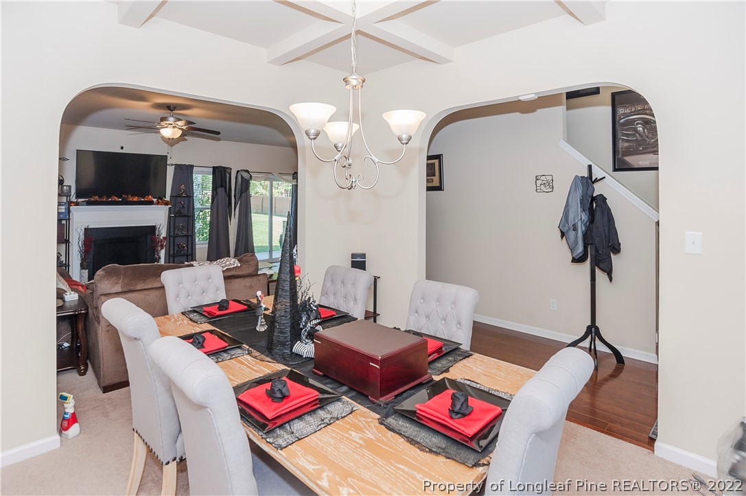 4980 Aberdeen Road Raeford, NC 28376 - Photo 5 of 38 a living room with furniture and a chandelier