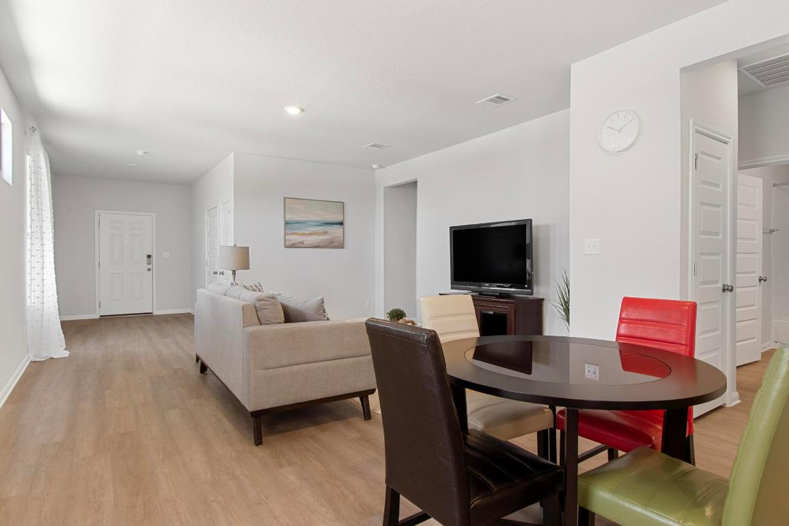 149 Cutleaf, Unit 31 San Marcos, TX 78666 - Photo 3 of 11 a living room with furniture and a flat screen tv