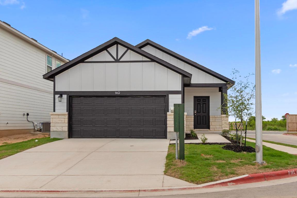 149 Cutleaf, Unit 31 San Marcos, TX 78666 - Photo 8 of 11 a front view of a house with garden
