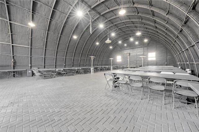a view of a chairs and table in a room