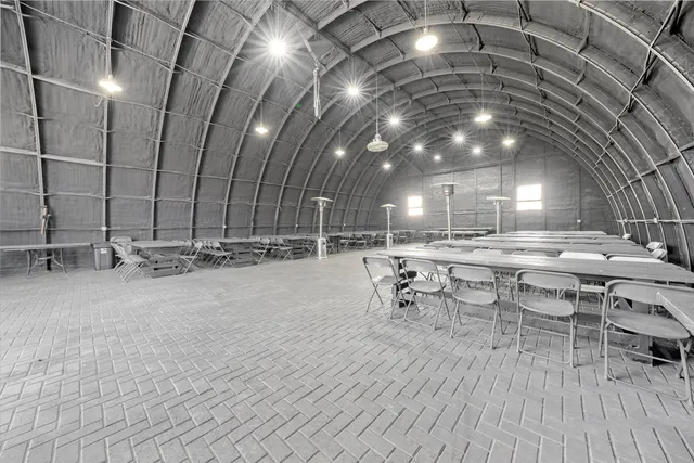a view of a chairs and table in a room