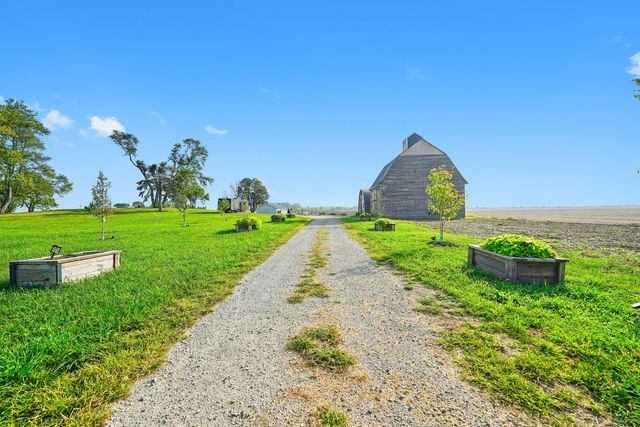 a backyard of a house with lots of green space