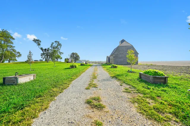 a backyard of a house with lots of green space