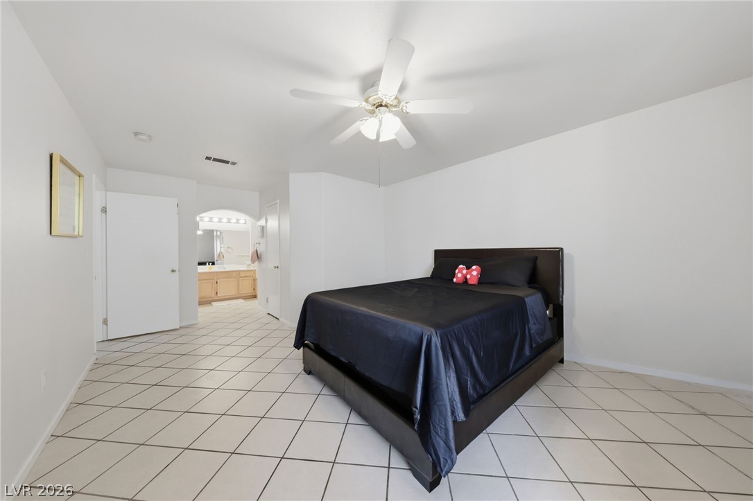 698 South Racetrack Road, Unit 1221 Henderson, NV 89015 - Photo 22 of 24 OVERSIZED PRIMARY BEDROOM WITH TILE FLOORING