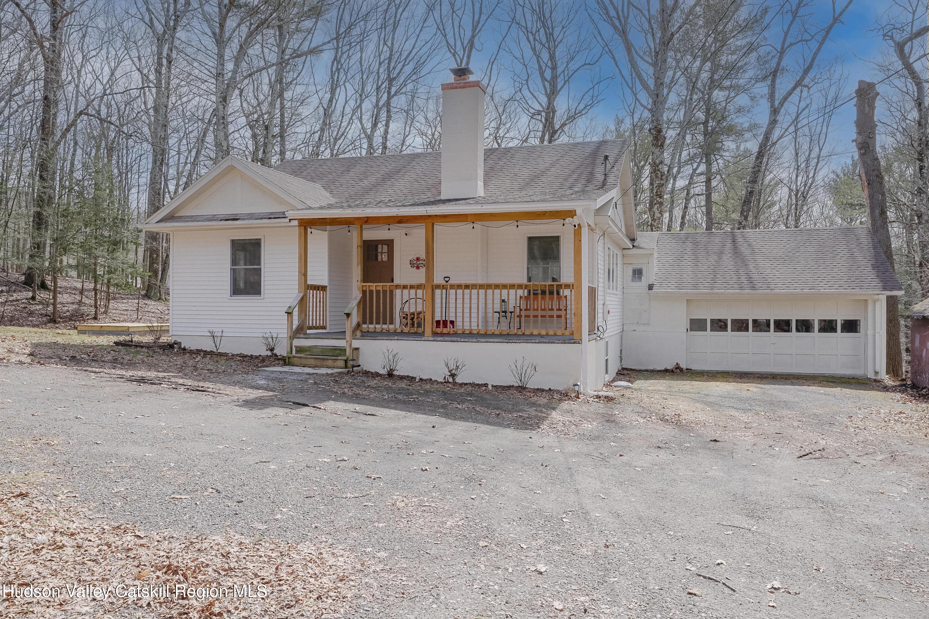 230 Potic Mountain Road Athens, NY 12414 - Photo 1 of 25 a view of a house with a snow in the yard