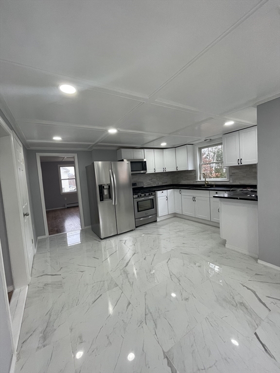 59 High Street Warren, MA 01083 - Photo 27 of 42 a view of a kitchen with a sink and cabinets