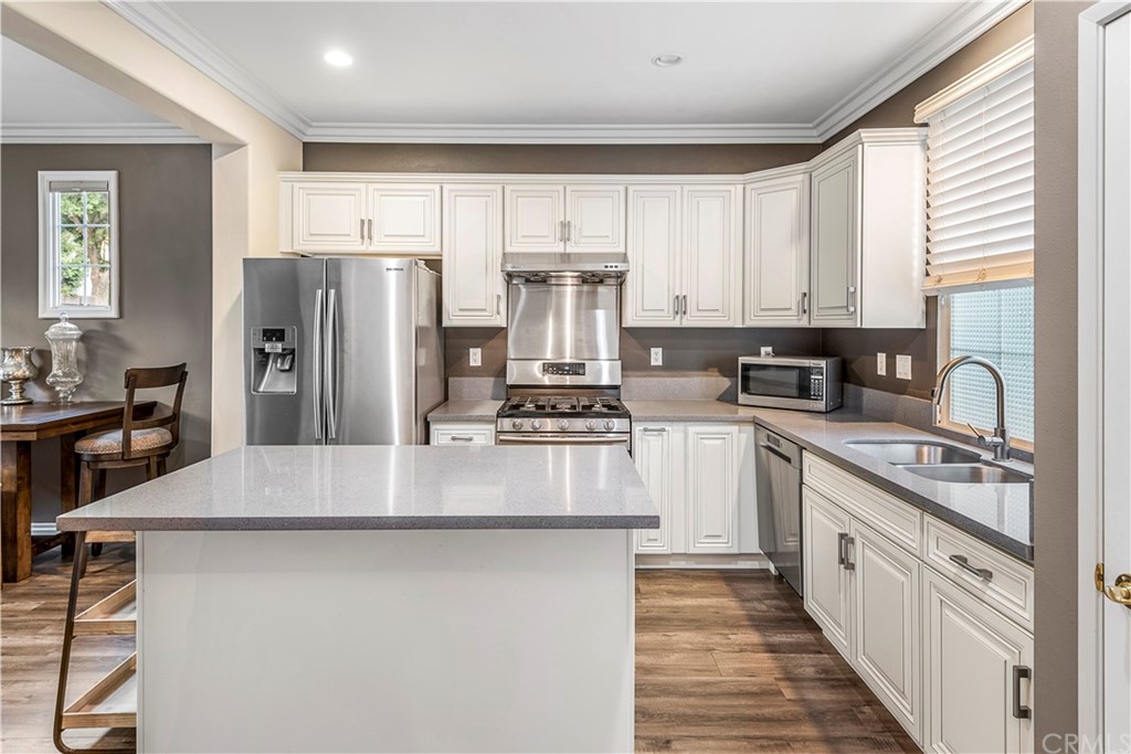 83 Sorenson Irvine, CA 92602 - Photo 1 of 1 a kitchen with refrigerator a stove and a window