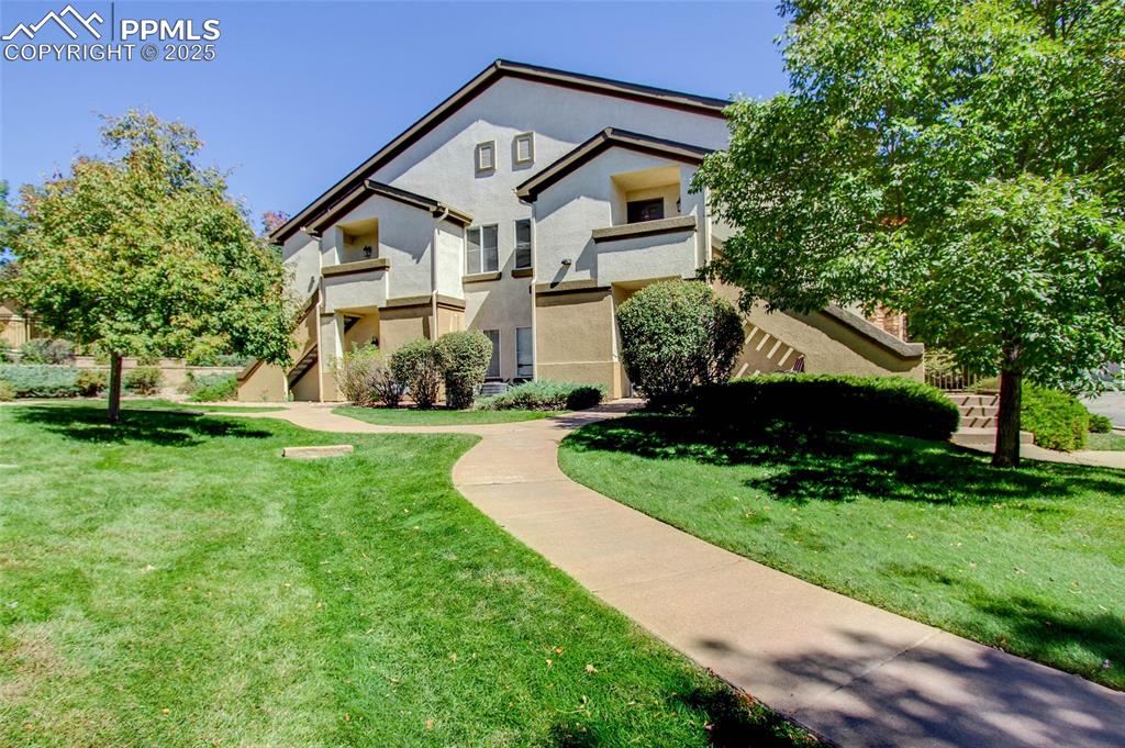 a front view of a house with a yard