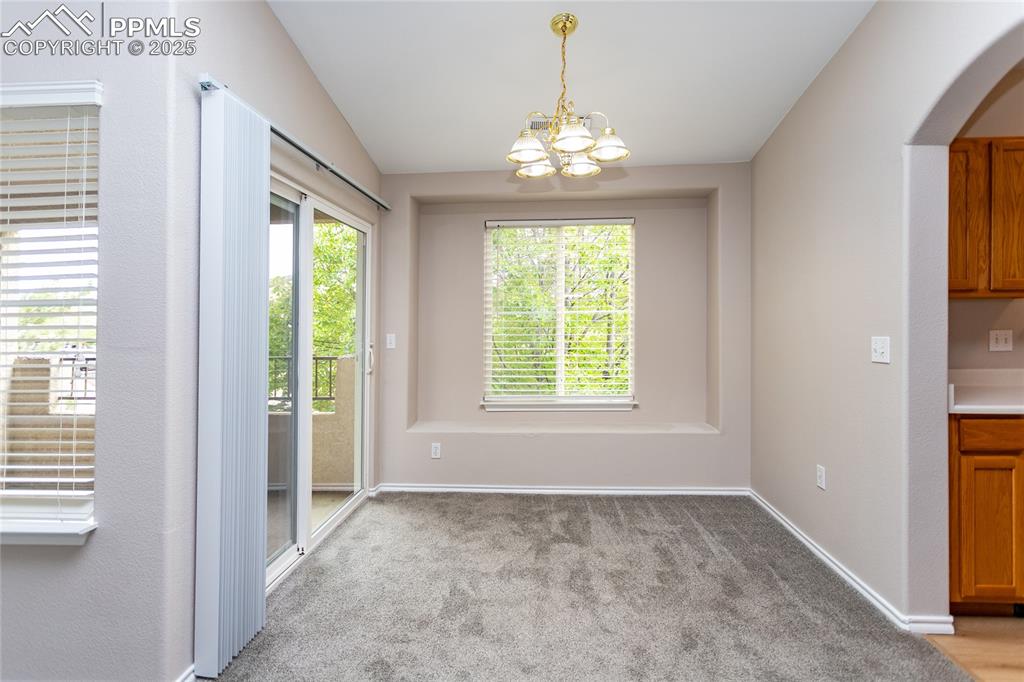 3815 Riviera Grove, Unit 201 Colorado Springs, CO 80922 - Photo 11 of 31 a view of an empty room with a window