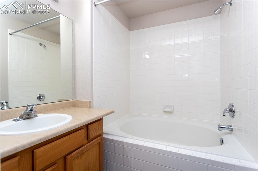 3815 Riviera Grove, Unit 201 Colorado Springs, CO 80922 - Photo 22 of 31 a bathroom with a sink and a bathtub
