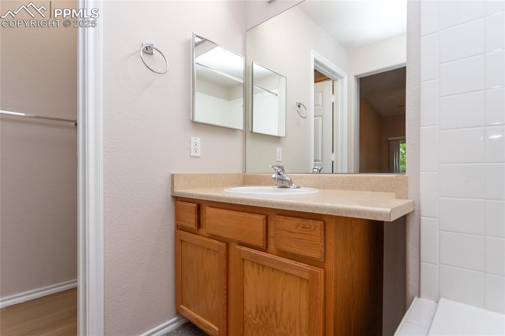 3815 Riviera Grove, Unit 201 Colorado Springs, CO 80922 - Photo 23 of 31 a bathroom with a sink and a mirror