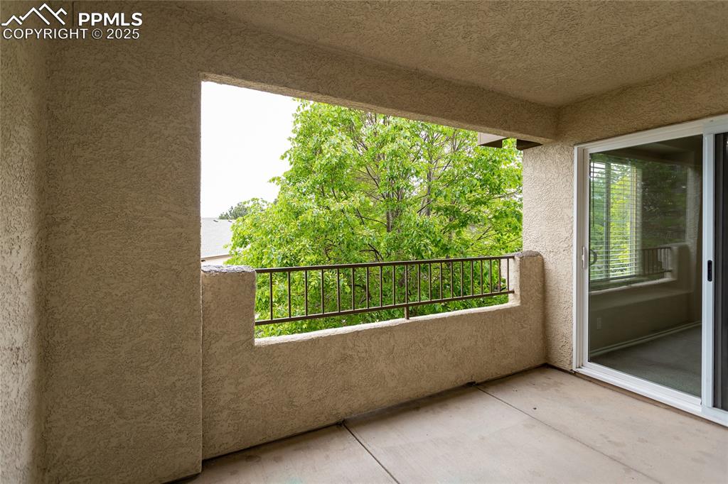 3815 Riviera Grove, Unit 201 Colorado Springs, CO 80922 - Photo 24 of 31 a view of a balcony with an outdoor space