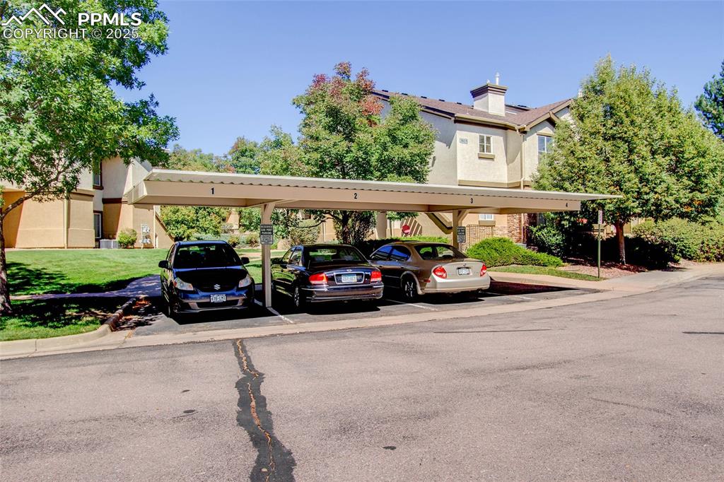 3815 Riviera Grove, Unit 201 Colorado Springs, CO 80922 - Photo 28 of 31 front view of a cars parked in front of a house