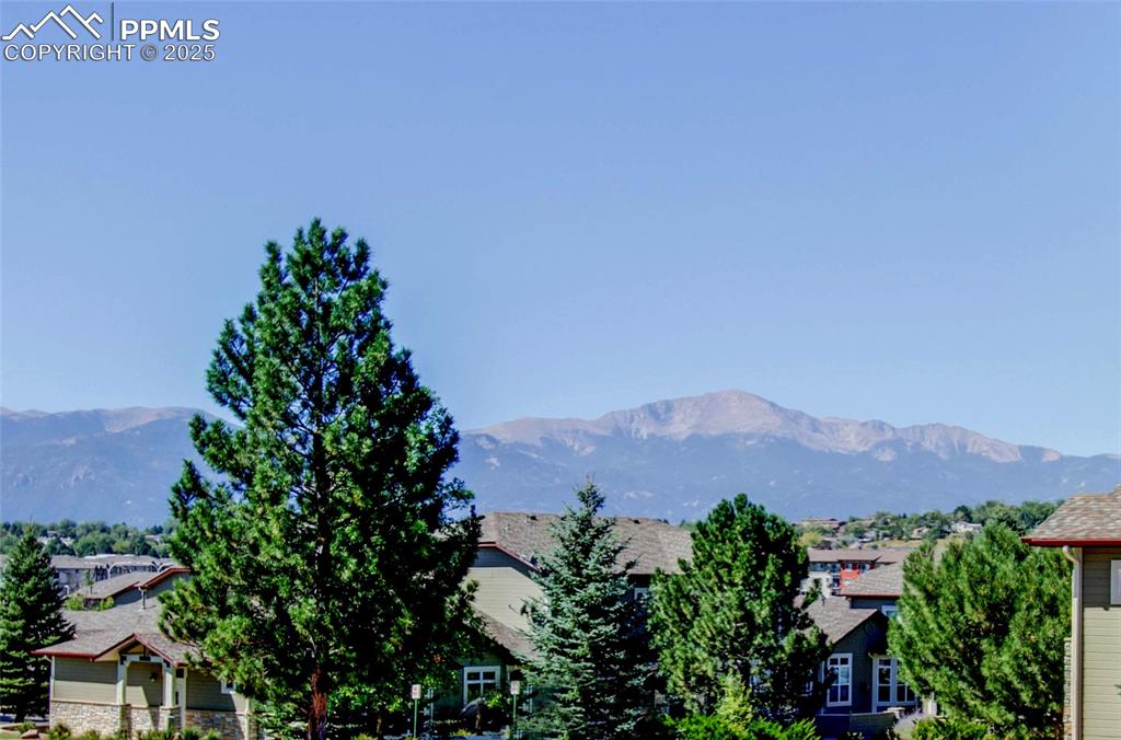 3815 Riviera Grove, Unit 201 Colorado Springs, CO 80922 - Photo 3 of 31 an aerial view of a city and mountain view