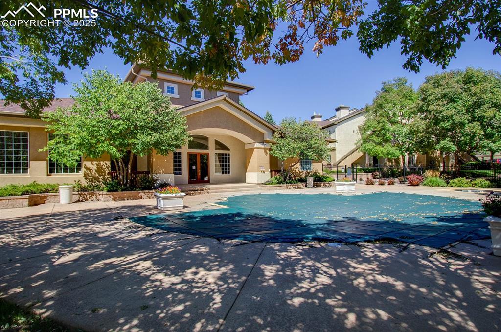 3815 Riviera Grove, Unit 201 Colorado Springs, CO 80922 - Photo 31 of 31 a front view of a house with a yard