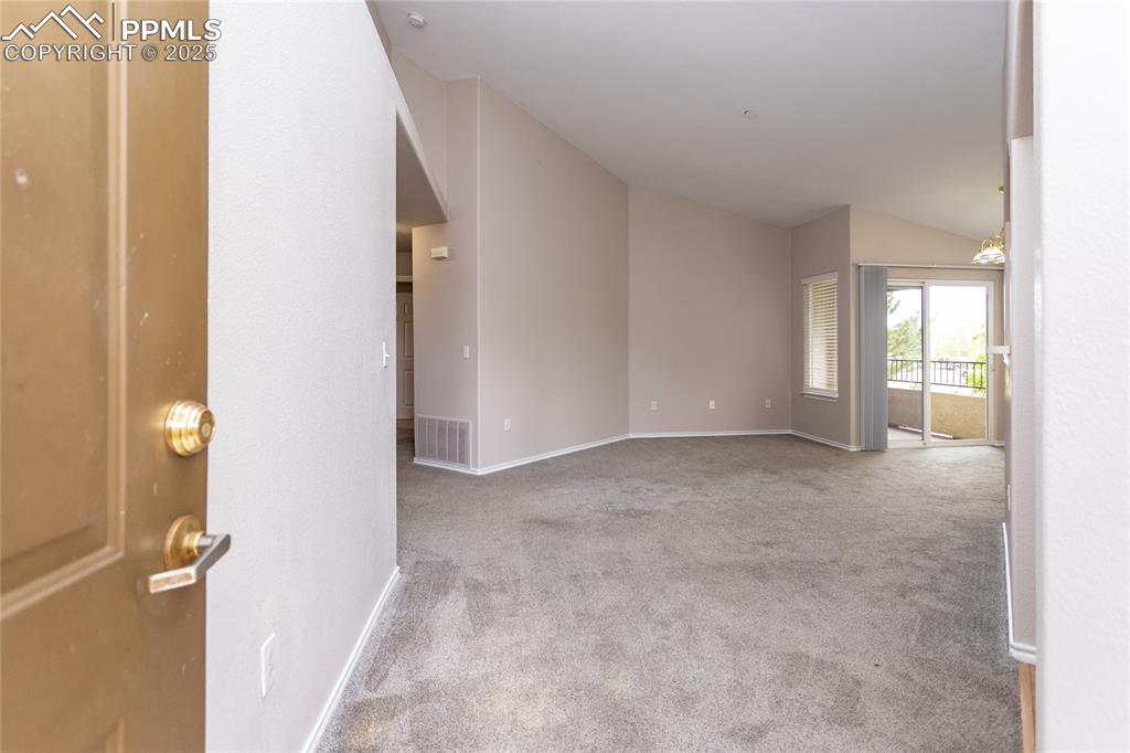 3815 Riviera Grove, Unit 201 Colorado Springs, CO 80922 - Photo 7 of 31 an empty room with windows