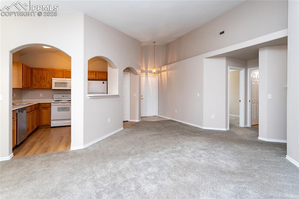 3815 Riviera Grove, Unit 201 Colorado Springs, CO 80922 - Photo 9 of 31 a view of empty room with fireplace