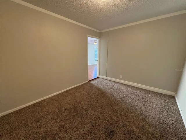 an empty room with a empty space and window