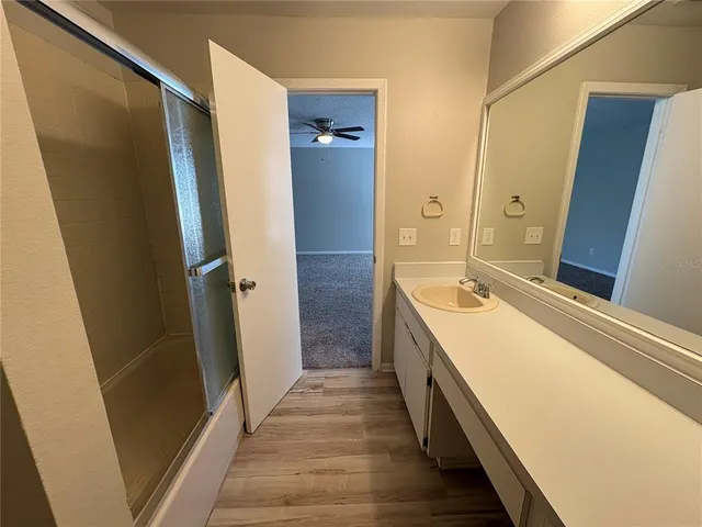 a bathroom with a double vanity sink and mirror