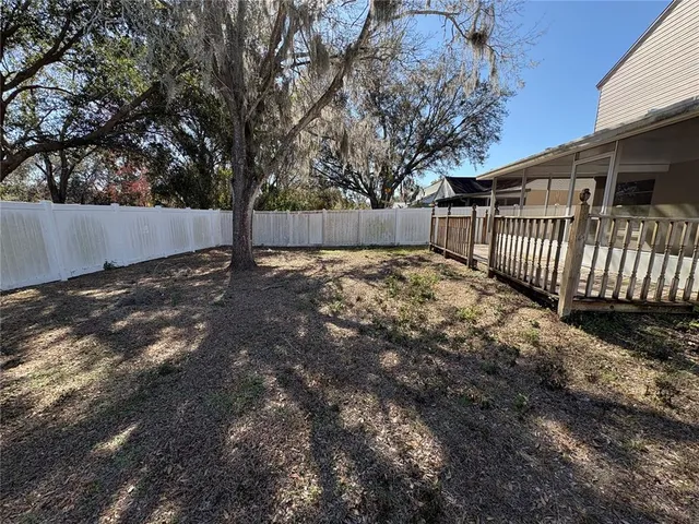a view of backyard and tree