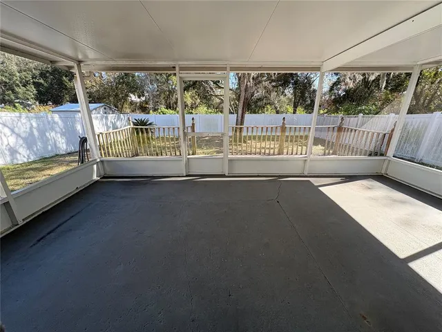 a view of a room with a large window