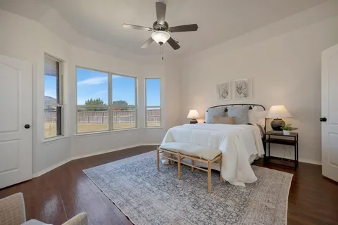 a bed room with a bed and a chandelier