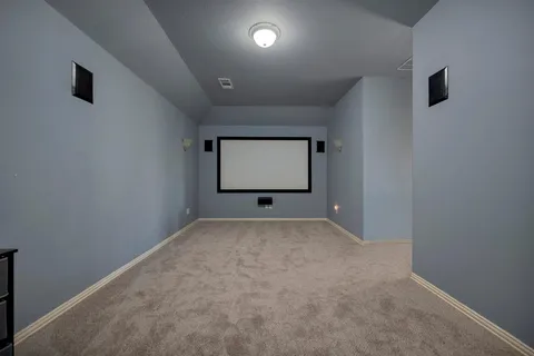 a bathroom with a sink a toilet and a large mirror