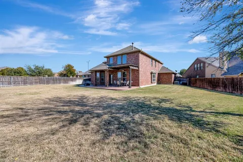 a house view with a swimming pool garden and outdoor space