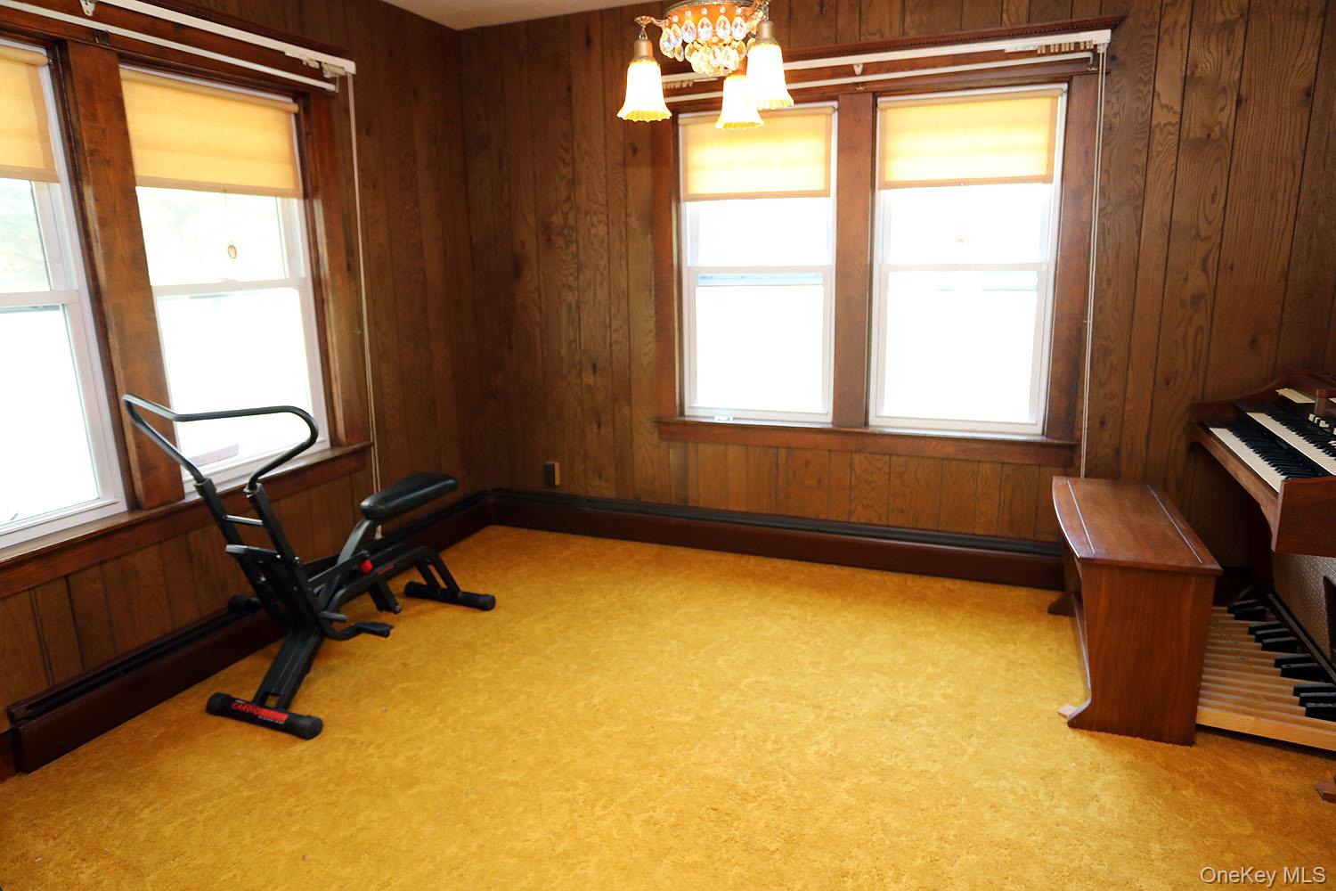 1779 Shandelee Road Livingston Manor, NY 12758 - Photo 11 of 31 a view of a room with gym equipment and a window