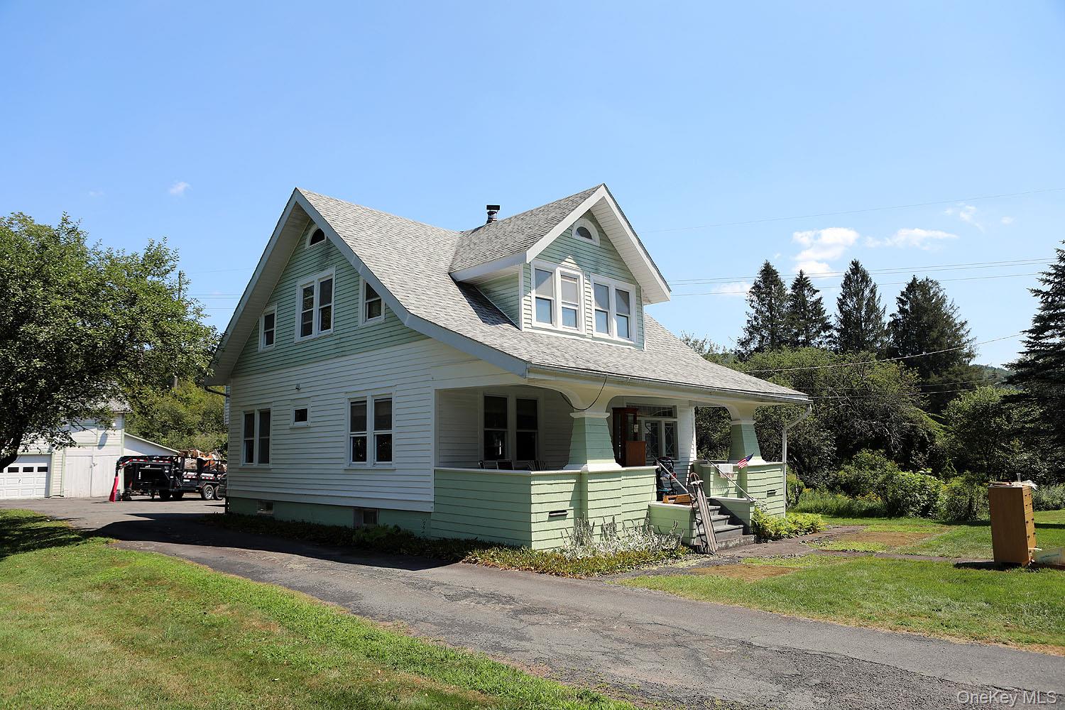 1779 Shandelee Road Livingston Manor, NY 12758 - Photo 2 of 31 a front view of a house with garden
