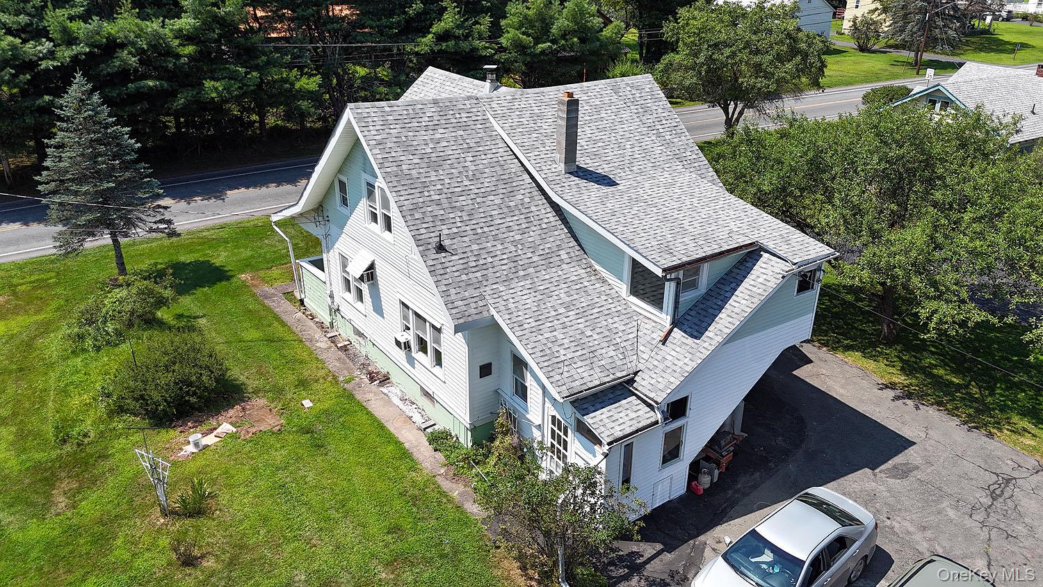 1779 Shandelee Road Livingston Manor, NY 12758 - Photo 31 of 31 a aerial view of a house with a yard and potted plants