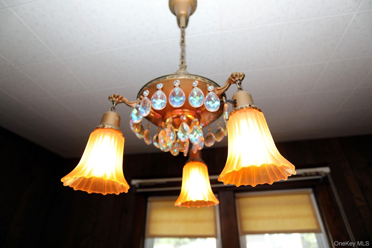 1779 Shandelee Road Livingston Manor, NY 12758 - Photo 10 of 31 a bedroom with a bed and a chandelier