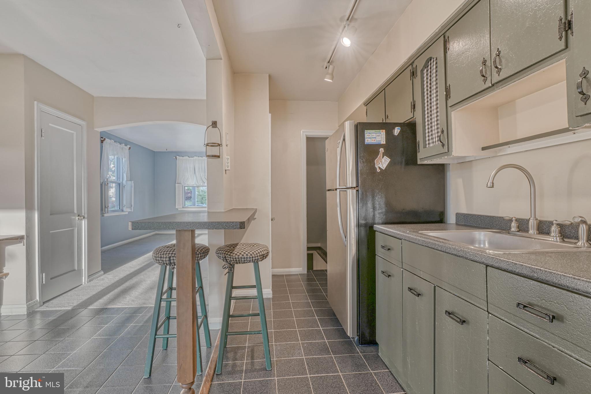 8324 Ridgely Oak Road Parkville, MD 21234 - Photo 12 of 25 a bathroom with a sink and a mirror