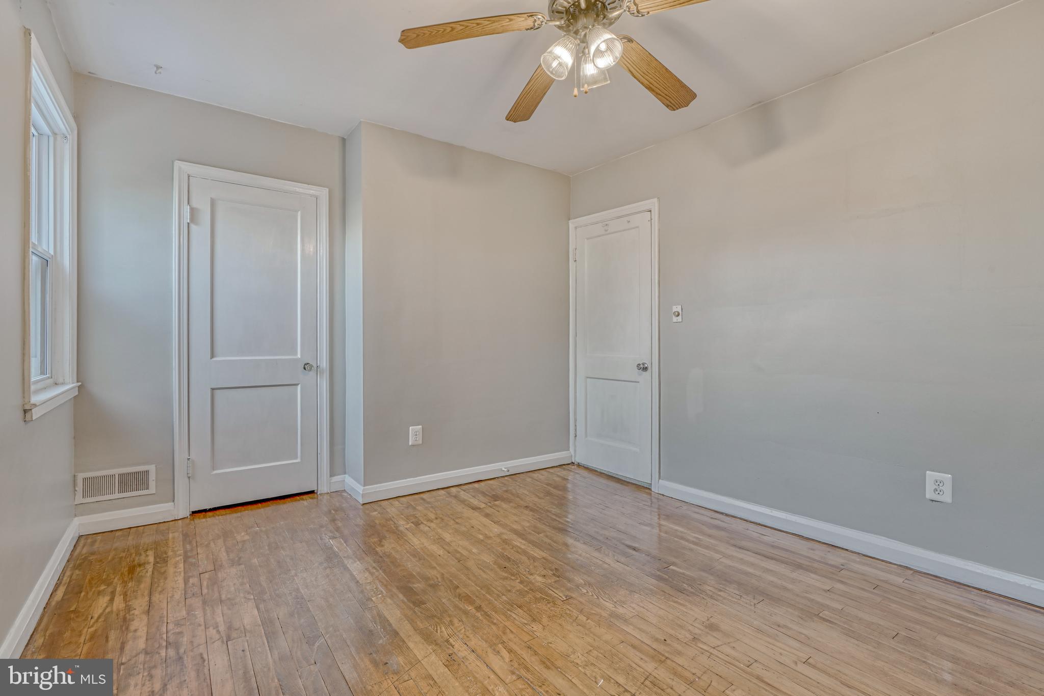 8324 Ridgely Oak Road Parkville, MD 21234 - Photo 14 of 25 wooden floor in an empty room