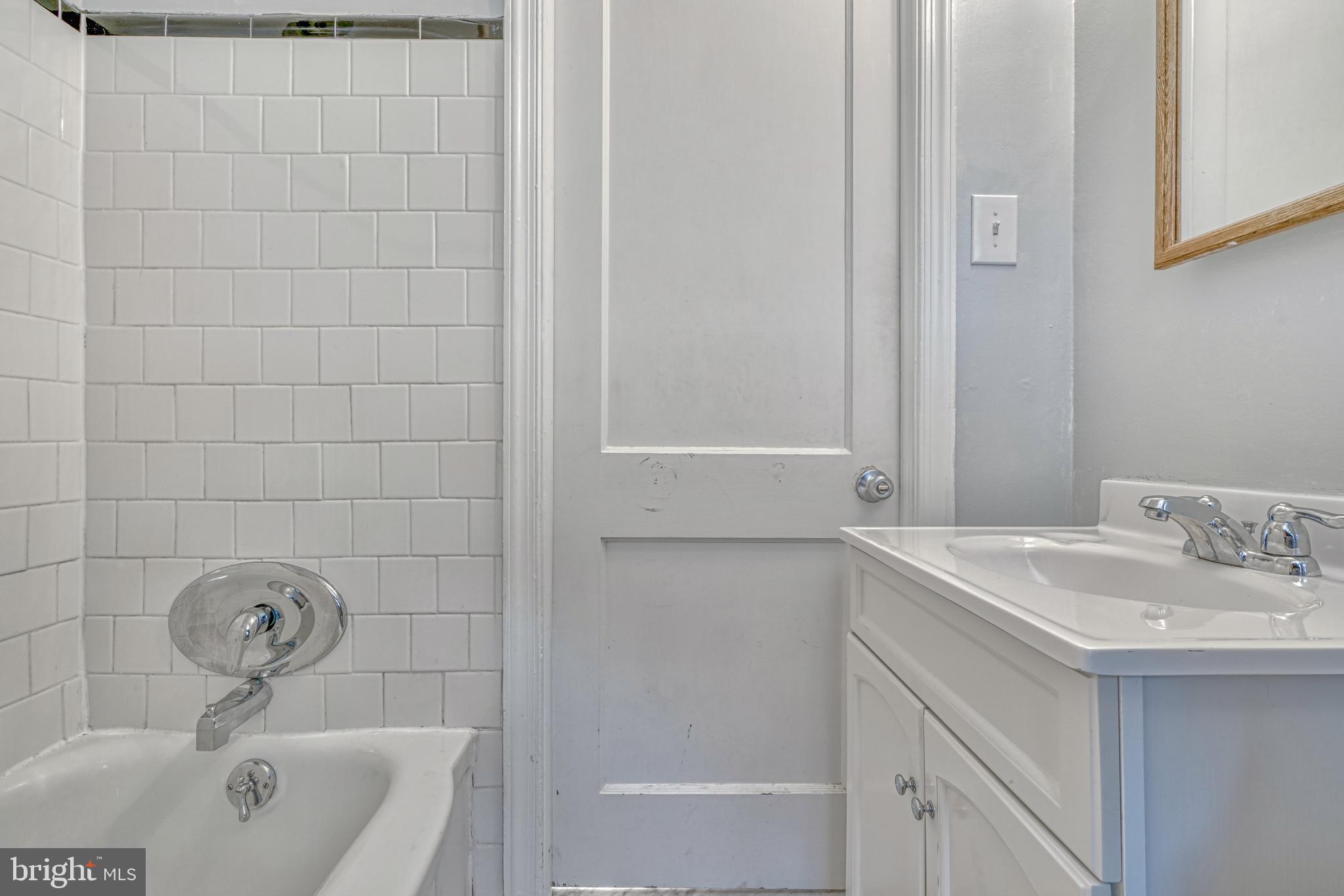 8324 Ridgely Oak Road Parkville, MD 21234 - Photo 16 of 25 a bathroom with a sink a toilet and shower
