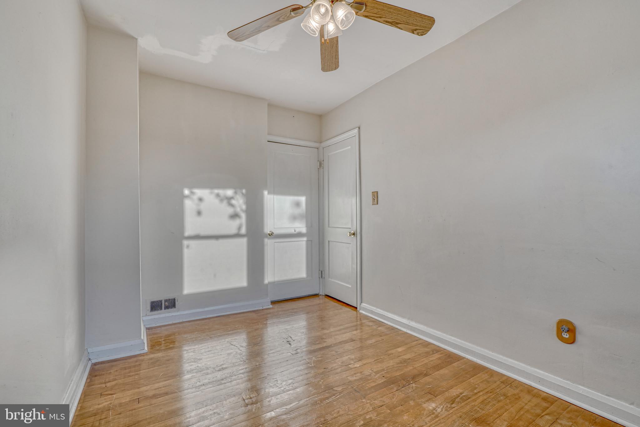 8324 Ridgely Oak Road Parkville, MD 21234 - Photo 18 of 25 a view of empty room with wooden floor