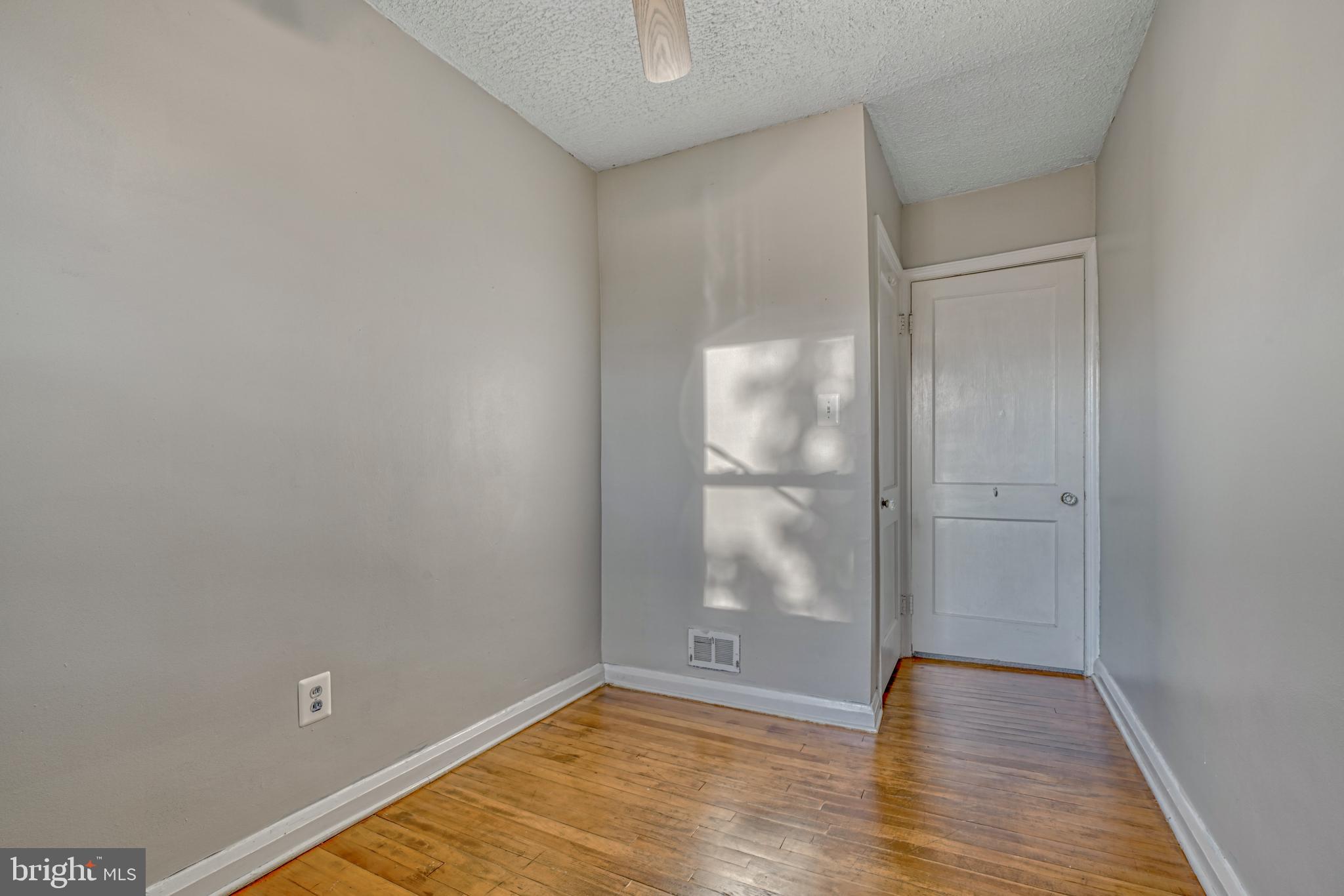 8324 Ridgely Oak Road Parkville, MD 21234 - Photo 20 of 25 a view of empty room with wooden floor