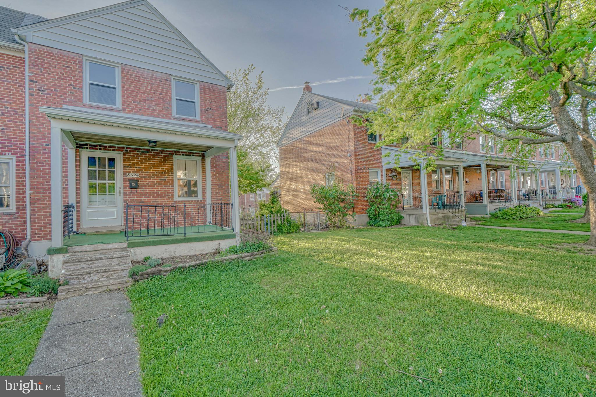 8324 Ridgely Oak Road Parkville, MD 21234 - Photo 2 of 25 a front view of a house with garden