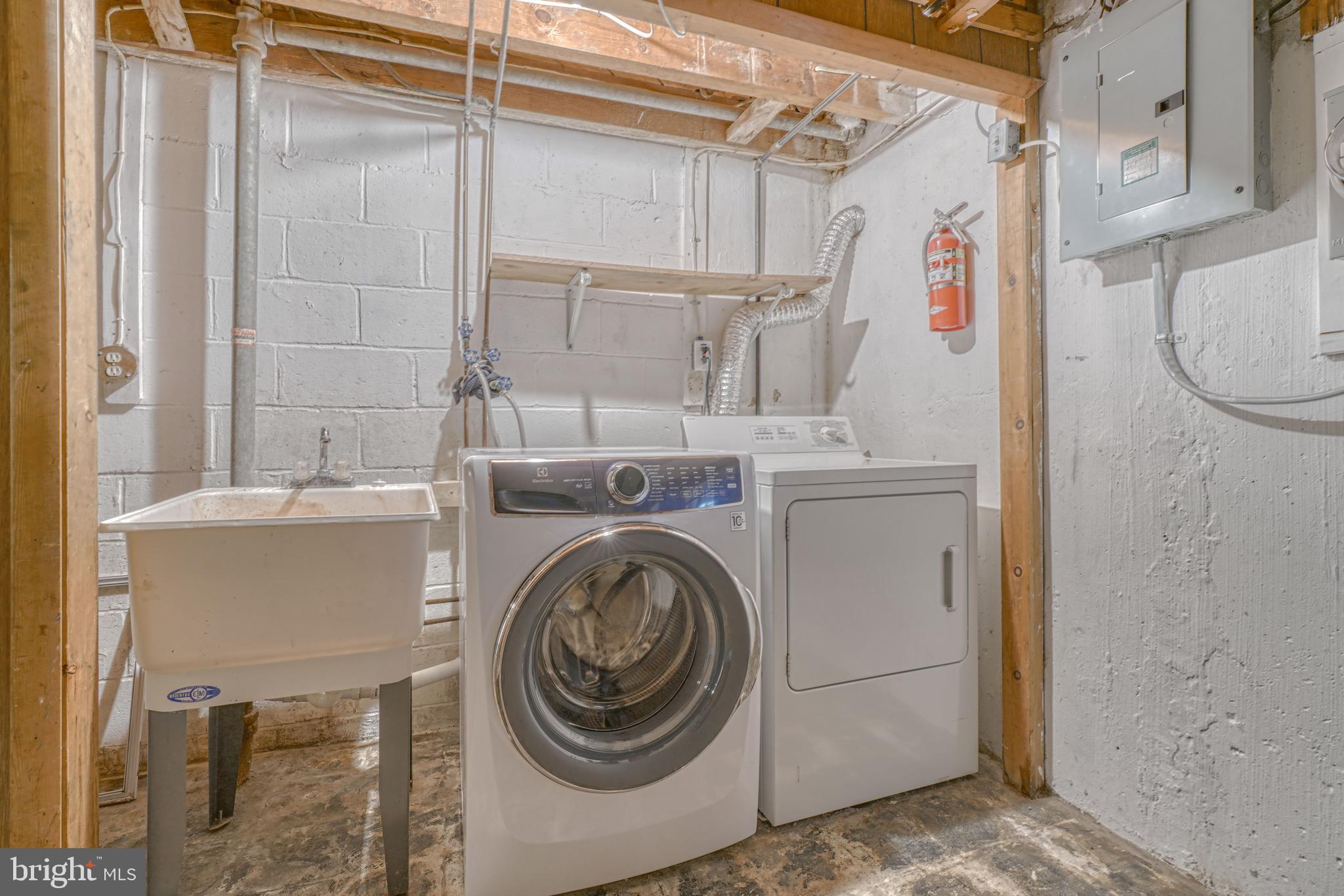 8324 Ridgely Oak Road Parkville, MD 21234 - Photo 23 of 25 a utility room with dryer and washer