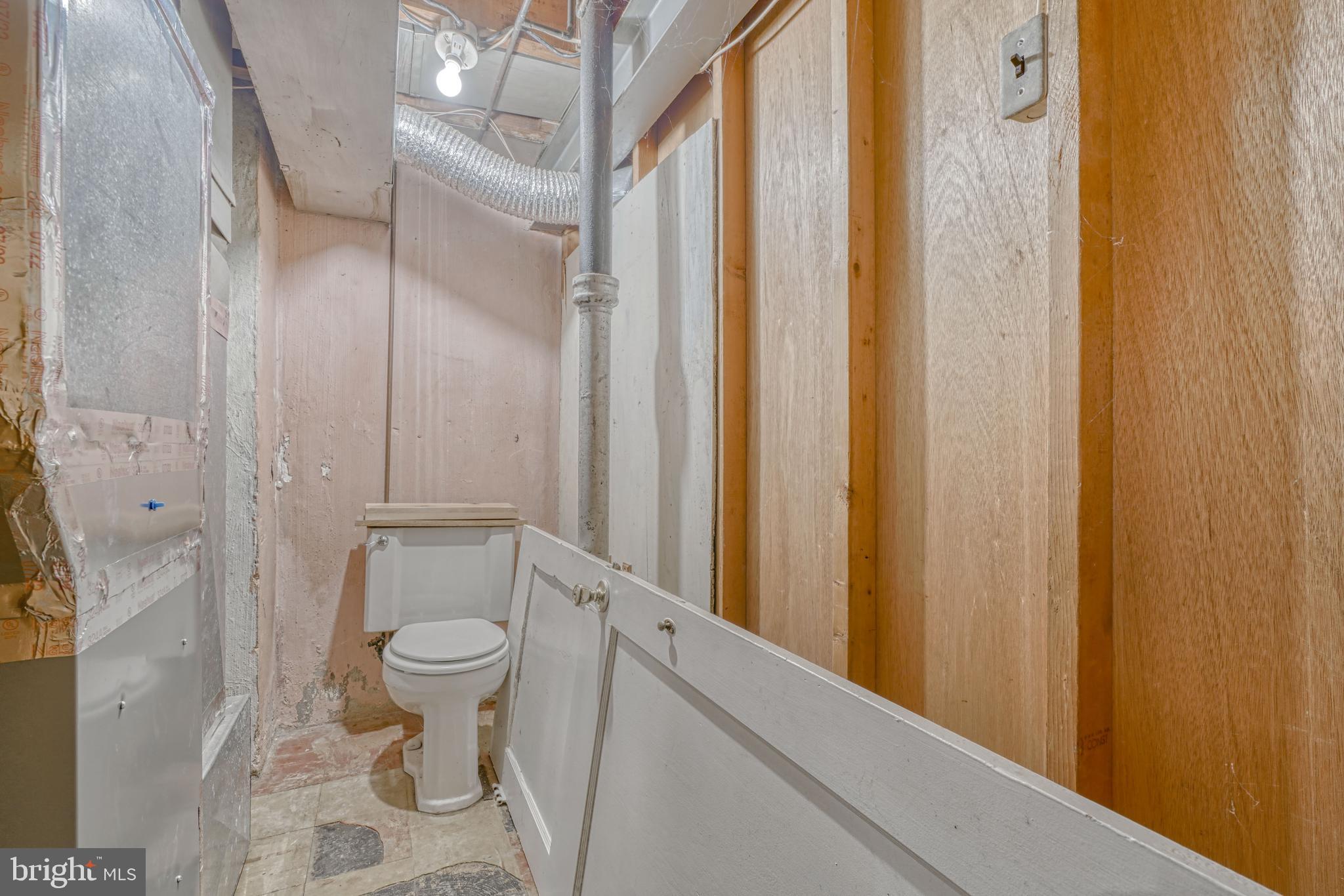 8324 Ridgely Oak Road Parkville, MD 21234 - Photo 25 of 25 a bathroom with a granite countertop sink toilet and shower