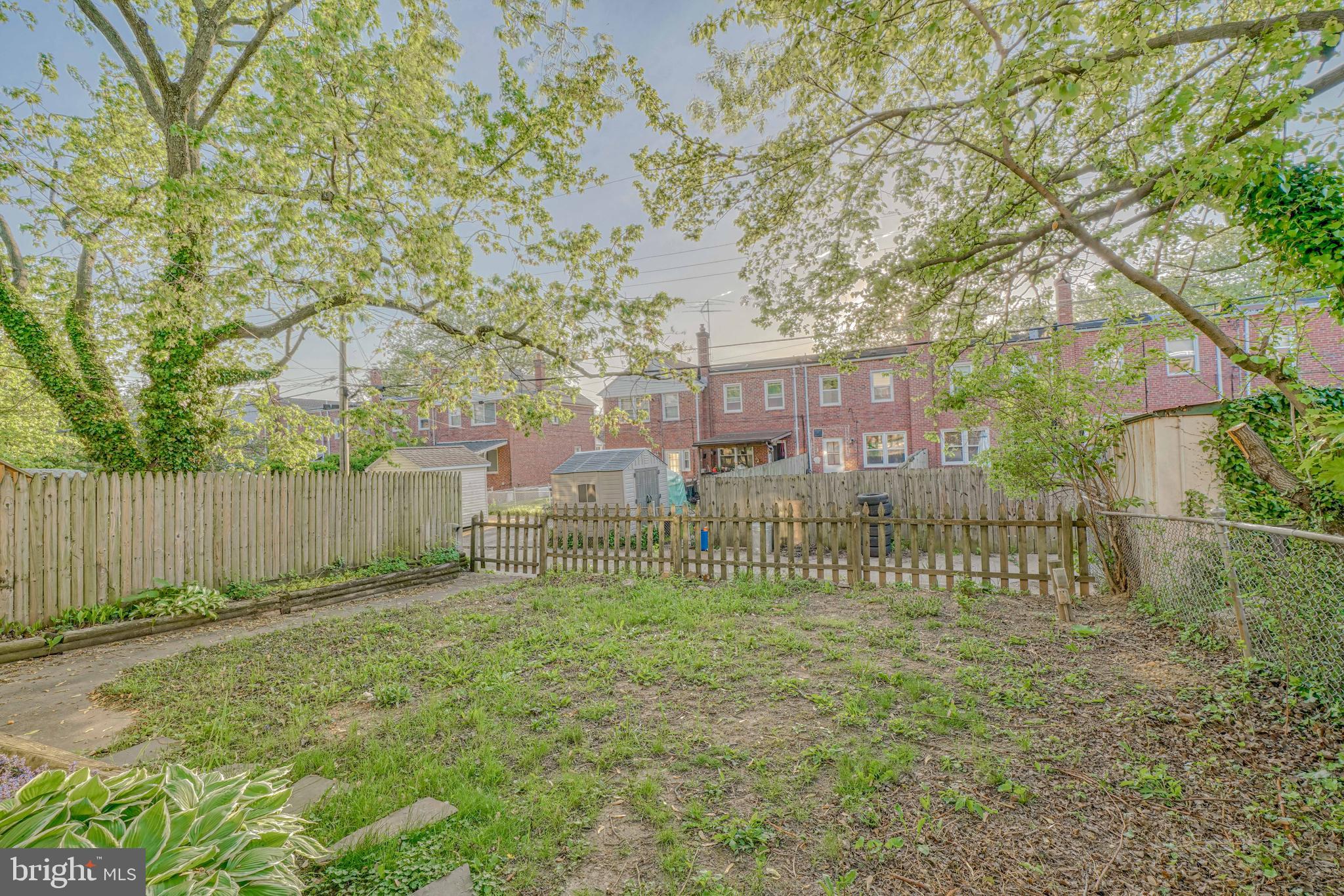8324 Ridgely Oak Road Parkville, MD 21234 - Photo 4 of 25 a garden view with a wooden fence